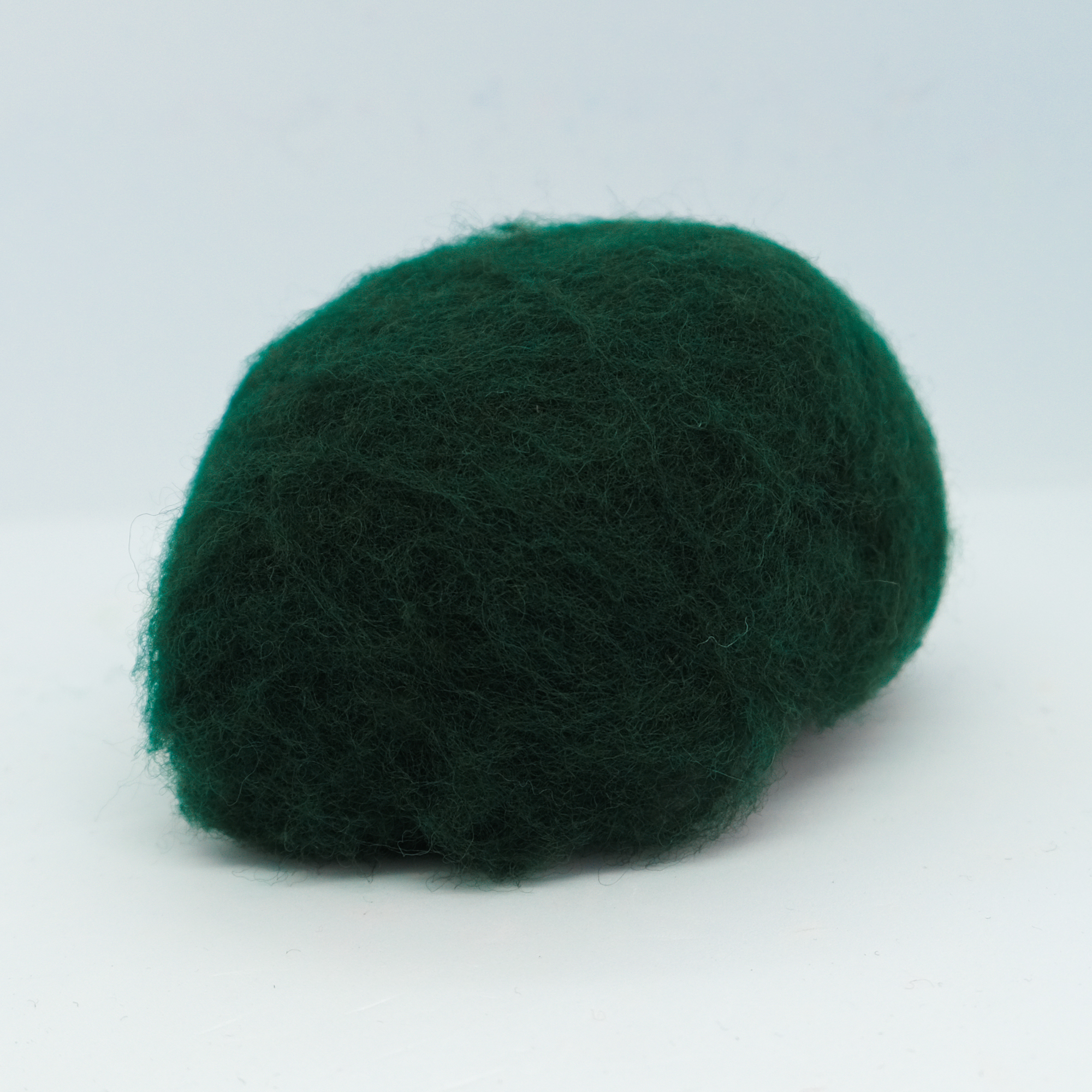 Kardet ull, kald mørkegrønn