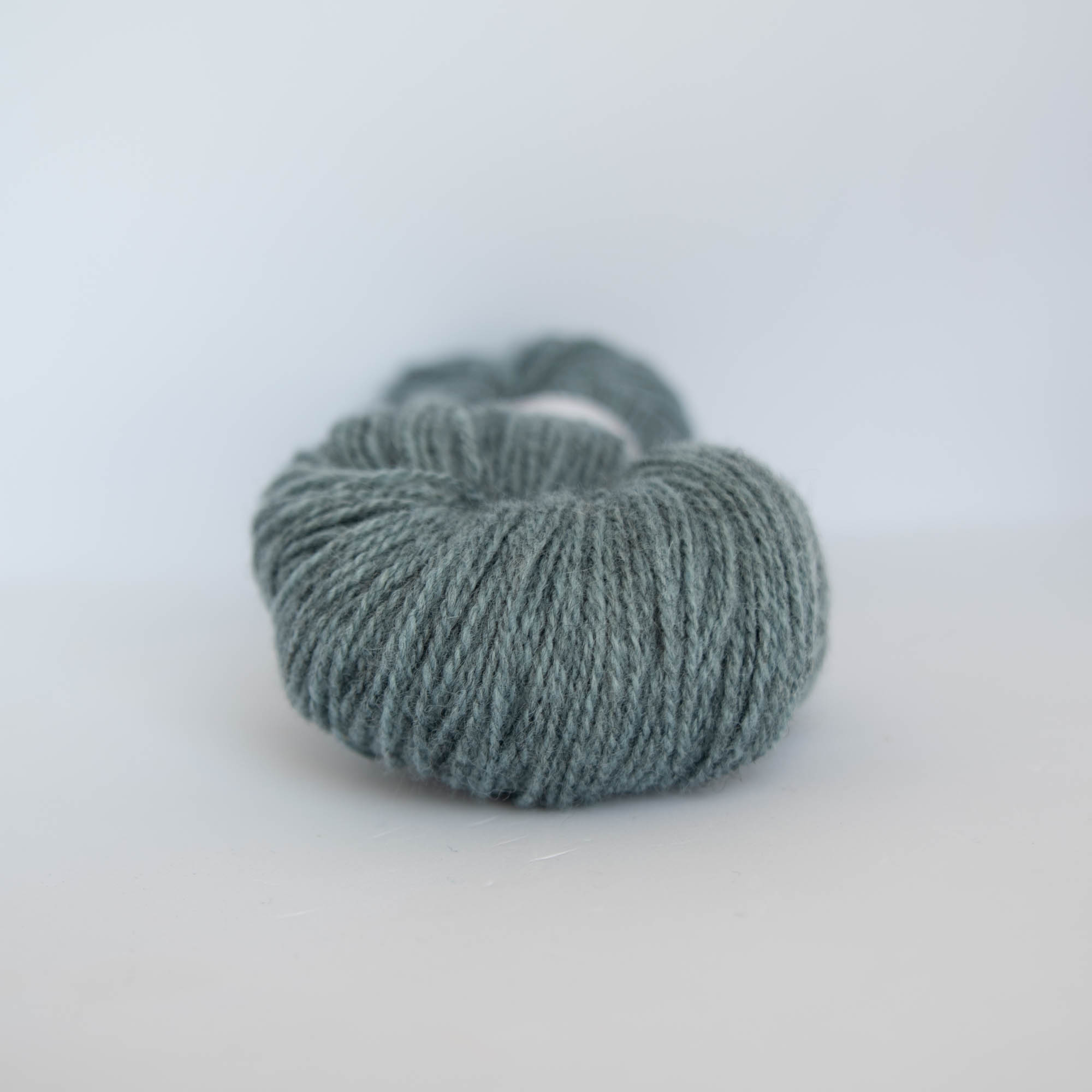 Ask ullgarn, melert lys grønnturkis